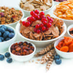 assortment of different breakfast cereal, dried fruit